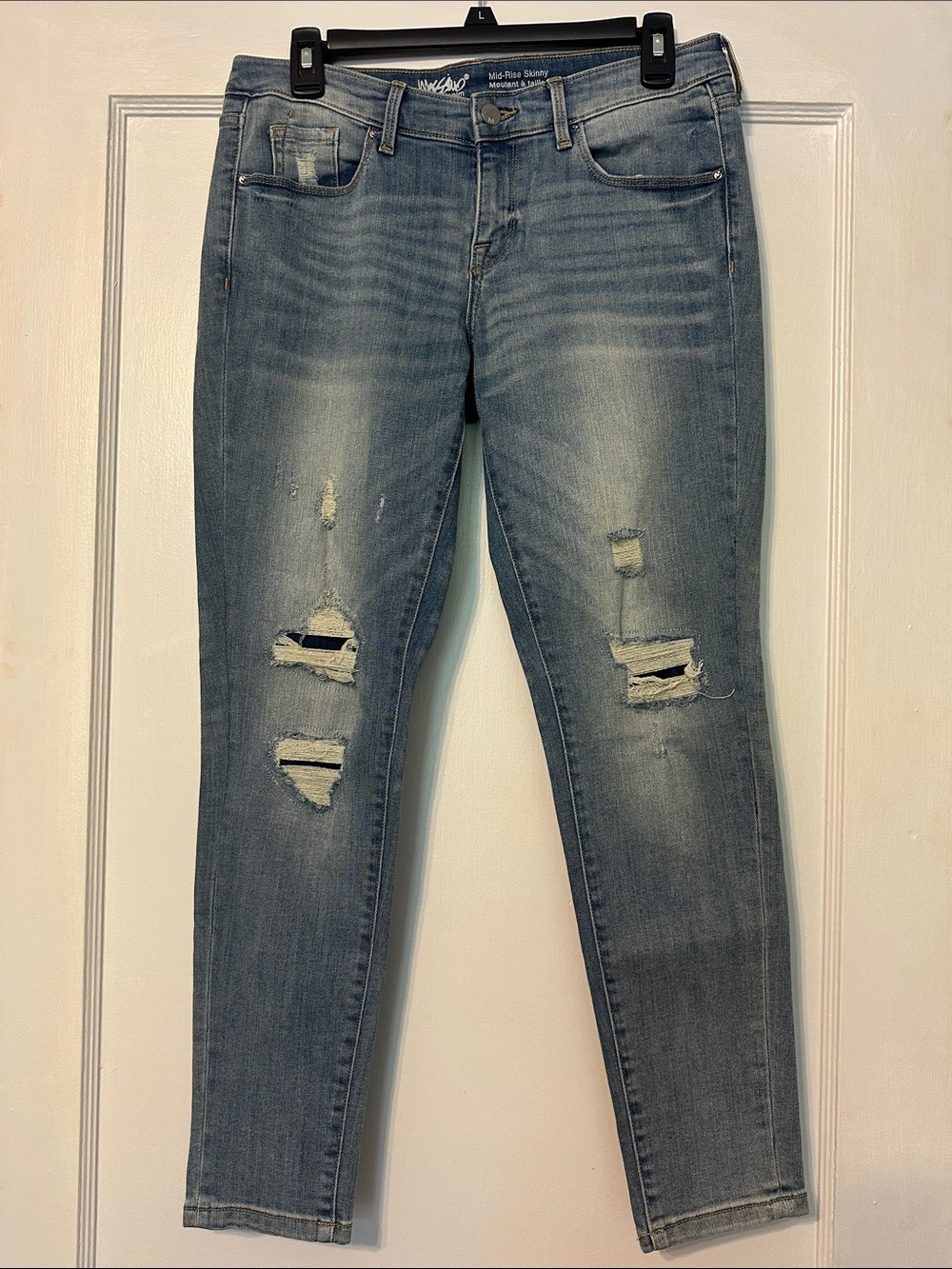 Mid-Rise Distressed Skinny Jeans in Light Blue